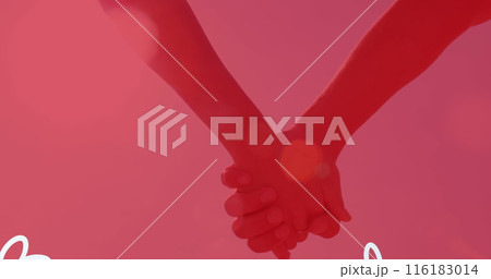 Two people holding hands against pink background 116183014