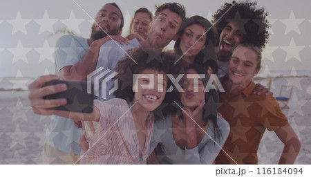 Image of happy independence day text and light spots over diverse friends at beach Image of happy independence day text and light spots over diverse friends at beach 116184094