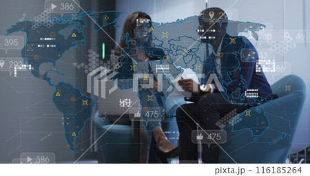 Image of social media icons against diverse businessman and businesswoman discussing at office 116185264