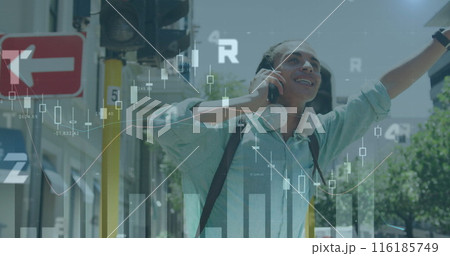 Image of graphs , changing number, biracial man calling on cellphone and raising hand 116185749