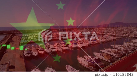 Boats docking in busy marina under a colorful sky 116185842