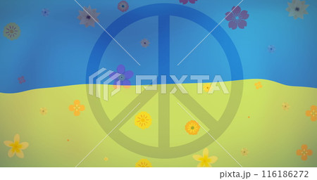 A large peace symbol dominating green hill under a blue sky 116186272