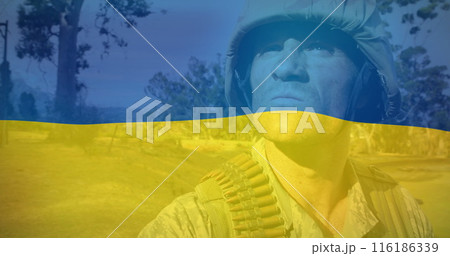 Caucasian male soldier wearing combat gear, standing outdoors 116186339