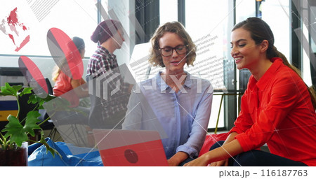 Image of statistical data processing over two diverse women discussing over laptop at office 116187763