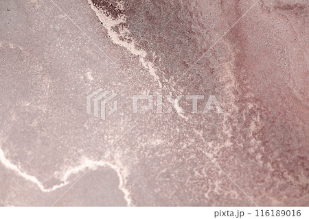 A close-up of a dusty rose sky at sunset with swirling clouds and glittering stars 116189016