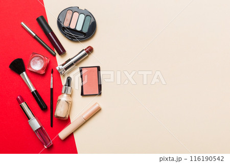 Professional makeup tools. Top view. Flat lay. Beauty, decorative cosmetics. Makeup brushes set and color eyeshadow palette on table background. Minimalistic style Professional makeup tools. Top view. Flat lay. Beauty, decorative cosmetics. Makeup brushes set and color eyeshadow palette on table background. Minimalistic style 116190542