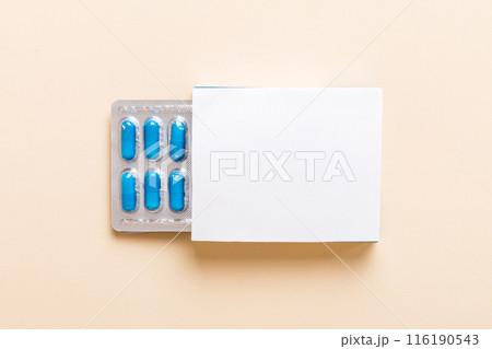 Blank White Product Package Box Mock-up. Open blank medicine drug box with blue pills blister top view 116190543