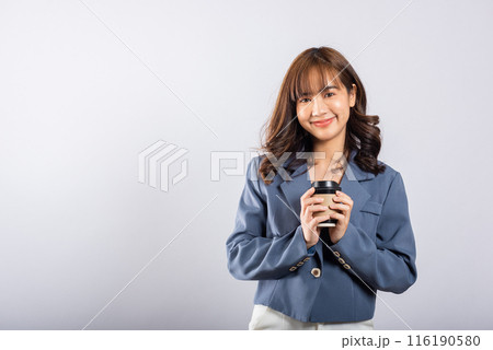 Portrait Asian beautiful happy young businesswoman standing smiling holding take away coffee paper cup, studio shot isolated on white background with copy space, coffee break 116190580