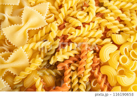 Pasta Noodles for cooking Italian food in plastic bag on white background. Pasta Noodles for cooking Italian food in plastic bag on white background. 116190658