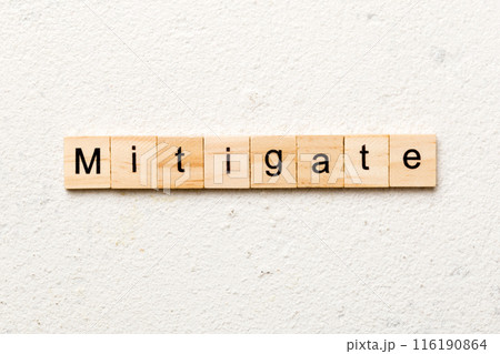 mitigate word written on wood block. mitigate text on table, concept mitigate word written on wood block. mitigate text on table, concept 116190864