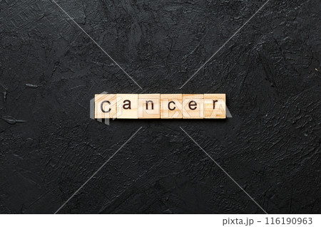 CANCER word written on wood block. CANCER text on cement table for your desing, concept 116190963