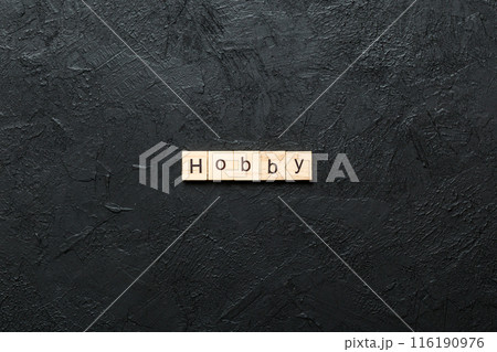 HOBBY word written on wood block. HOBBY text on cement table for your desing, concept 116190976