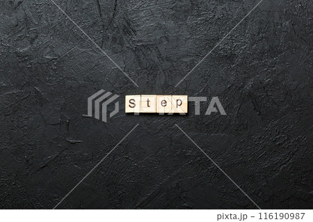 step word written on wood block. step text on table, concept step word written on wood block. step text on table, concept 116190987
