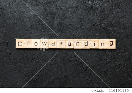 CROWDFUNDING word written on wood block. CROWDFUNDING text on cement table for your desing, concept 116191150