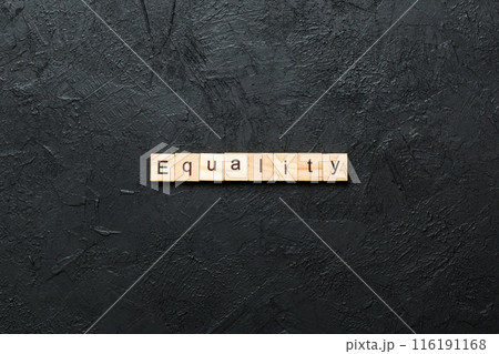 Equality word written on wood block. Equality text on cement table for your desing, concept 116191168