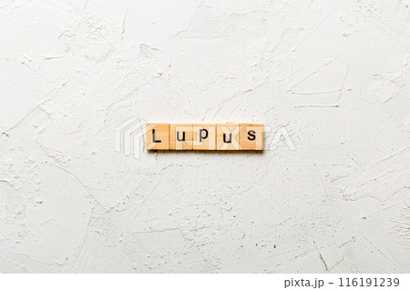 lupus word written on wood block. lupus text on table, concept 116191239