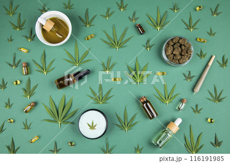 Flat lay, Top view of marijuana leaves and cannabis buds, cbd concept Flat lay, Top view of marijuana leaves and cannabis buds, cbd concept 116191985