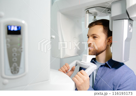 Panoramic image of teeth. A patient in a modern dental clinic takes a panoramic picture of the teeth. Prevention of dental diseases. Accurate diagnosis. 116193173