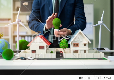 Businessman team brainstorming using tablet, laptop computer for working technology and business,  Renewable energy-based green businesses and global warming. Reduce CO2 emission. 116193798