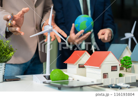 Businessman team brainstorming using tablet, laptop computer for working technology and business,  Renewable energy-based green businesses and global warming. Reduce CO2 emission. 116193804
