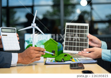Businessman team brainstorming using tablet, laptop computer for working technology and business, Renewable energy-based green businesses and global warming. Reduce CO2 emission. Businessman team brainstorming using tablet, laptop computer for working technology and business, Renewable energy-based green businesses and global warming. Reduce CO2 emission. 116193815