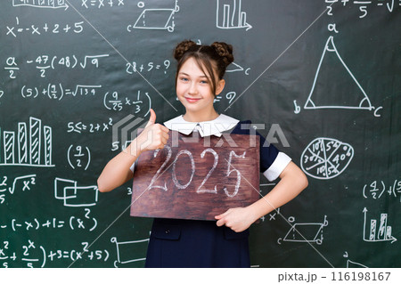 Back to school 2025 school year, schoolgirl holding a sign near the chalkboard 116198167