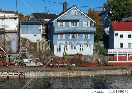 Coastal view of Kristiansund with wooden houses on a sunny day Coastal view of Kristiansund with wooden houses on a sunny day 116199075