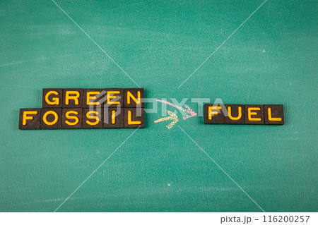 Green and Fossil Fuel Concept. Old letter tiles on a green chalkboard background 116200257