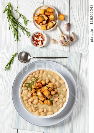 rosemary garlic creamy white bean soup in bowl 116201548