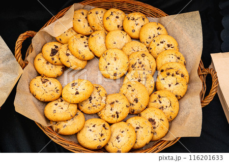 Homemade cookies with chocolate chunks on a tray. Perfect for snacks or dessert, these delicious treats 116201633