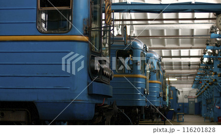 Metro trains are waiting for inspection. Railway depot. The subway building. 116201828