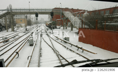 Railway industrial zone. An old factory with an overpass. Winter in an industrial city. Railway industrial zone. An old factory with an overpass. Winter in an industrial city. 116201906