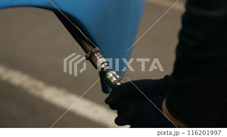 Locomotive repair. The craftsman repairs the hydraulic system. 116201997