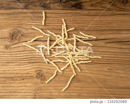 Raw Trofie Pasta, Dry Italian Macaroni, Traditional Genoa Food, Raw Noodle, Modern Ligurian Cuisine Raw Trofie Pasta, Dry Italian Macaroni, Traditional Genoa Food, Raw Noodle, Modern Ligurian Cuisine 116202089