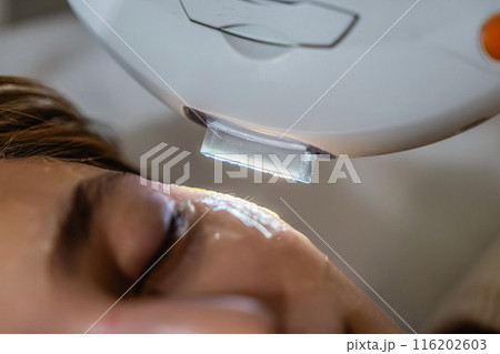Phototherapy, photorejuvenation, IPL in a beauty salon. Care for a woman's face. Phototherapy, photorejuvenation, IPL in a beauty salon. Care for a woman's face. 116202603