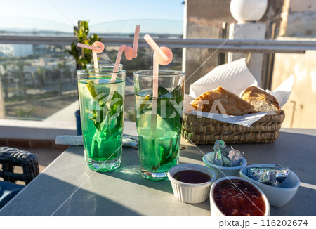 Moroccan hotel breakfast, also known as ftour, mint tea, bread basket, outdoor dining, morning meal 116202674