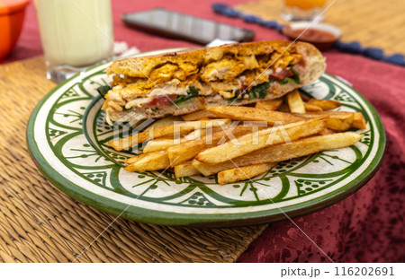 Chicken sandwich, French fries, Moroccan street food, fast food, handheld meal, traditional cuisine 116202691