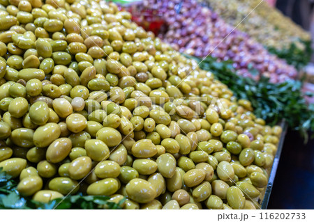 Pickled Olives Pile, Fermented Olives, Marinated Mediterranean Snack, large piles of Olive Pickles 116202733