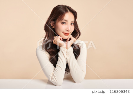 Beautiful young asian woman with clean fresh skin on beige background, Face care, Facial treatment, Cosmetology, beauty and spa, Asian women portrait. Beautiful young asian woman with clean fresh skin on beige background, Face care, Facial treatment, Cosmetology, beauty and spa, Asian women portrait. 116206348