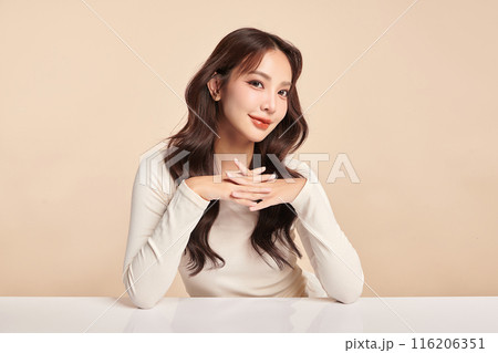 Beautiful young asian woman with clean fresh skin on beige background, Face care, Facial treatment, Cosmetology, beauty and spa, Asian women portrait. Beautiful young asian woman with clean fresh skin on beige background, Face care, Facial treatment, Cosmetology, beauty and spa, Asian women portrait. 116206351