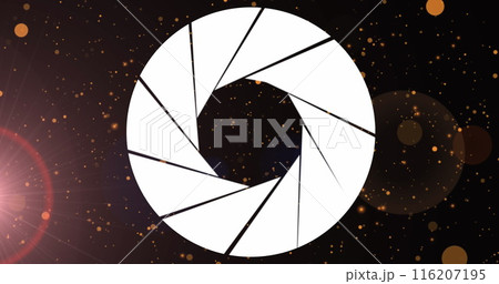 Image of lens diaphragm icon over orange spots and spots of light against black background 116207195