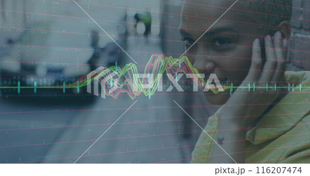 Image of data processing against biracial woman listening to music from smartphone on the street 116207474