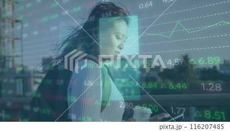 Image of stock market data processing against asian woman using smartphone on the street 116207485