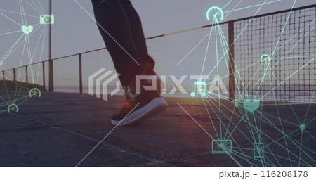 Image of connected icons globes over low section of person running at beach Image of connected icons globes over low section of person running at beach 116208178