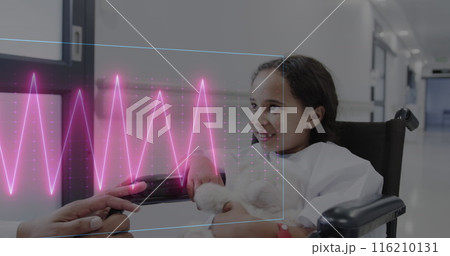Image of heart rate monitor over biracial girl with soft toy in wheelchair talking at hospital 116210131