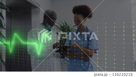 Image of heart rate monitor over diverse male doctor and healthworker discussing at hospital Image of heart rate monitor over diverse male doctor and healthworker discussing at hospital 116210218