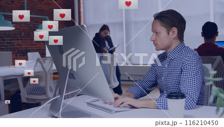 Image of heart shape in envelopes over biracial man working on desktop in office Image of heart shape in envelopes over biracial man working on desktop in office 116210450