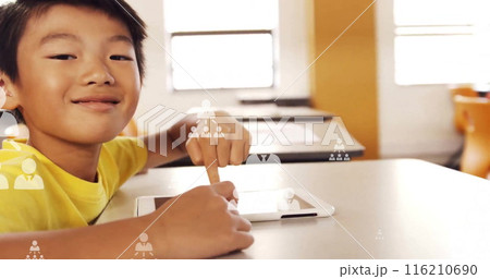 Image of profile icons flowcharts over asian man using digital tablet in classroom at school 116210690