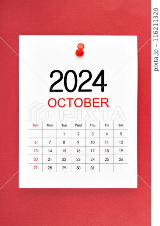 October 2024 calendar page with push pin on red background. 116211320