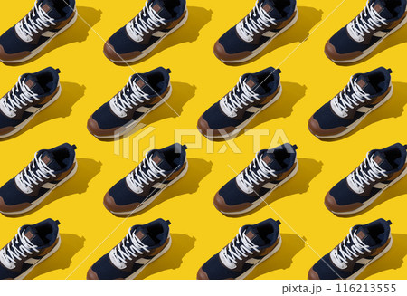 Sneakers shoes pattern on yellow background. 116213555